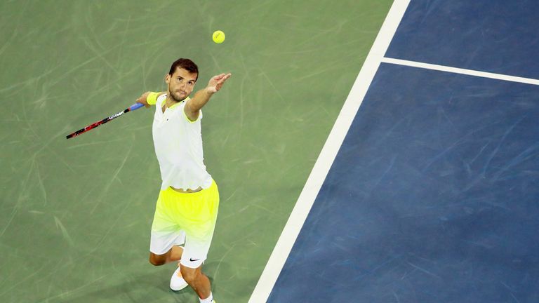Grigor Dimitrov of Bulgaria serves to Jeremy Chardy of France during the US Open