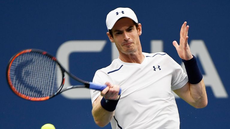 Andy Murray of Great Britain returns a shot to Kei Nishikori of Japan at the US Open