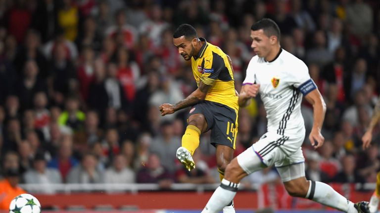 Theo Walcott of Arsenal scores his team's second goal during the UEFA Champions League Group A match against Basel