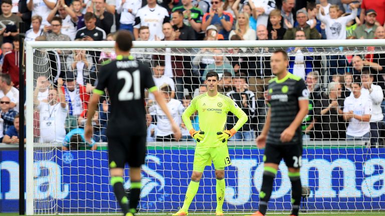 Chelsea goalkeeper Thibaut Courtois (centre) appears dejected during the Premier League match at the Liberty Stadium, Swansea