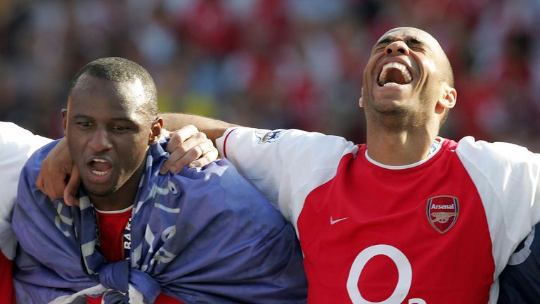 LONDON, UNITED KINGDOM:  Arsenal's Patrick Vieira (L) and Thierry Henry celebrate after winning the Premiership title and defeating Leicsester City 15 May,