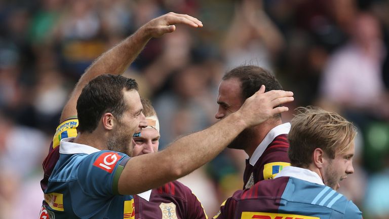 Tim Visser of Harlequins celebrates scoring a try