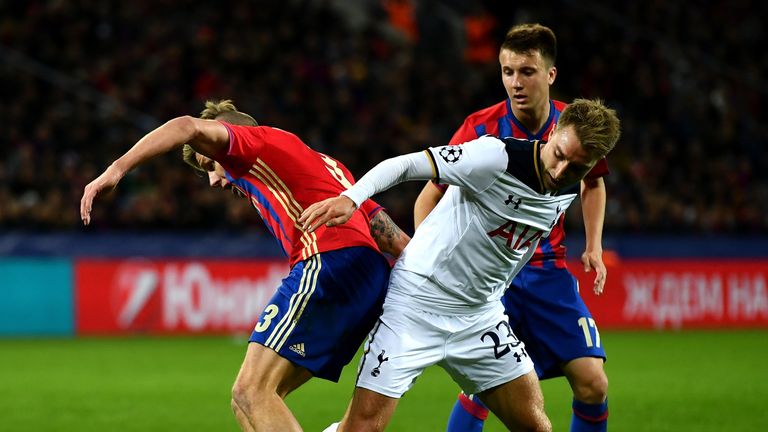 Christian Eriksen of Tottenham battles with Pontus Wernbloom and Aleksandr Golovin of CSKA Moscow 