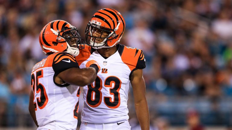 JACKSONVILLE, FL - AUGUST 28: Giovani Bernard #25 of the Cincinnati Bengals celebrates with Tyler Boyd #83 after rushing for a touchdown during the first q