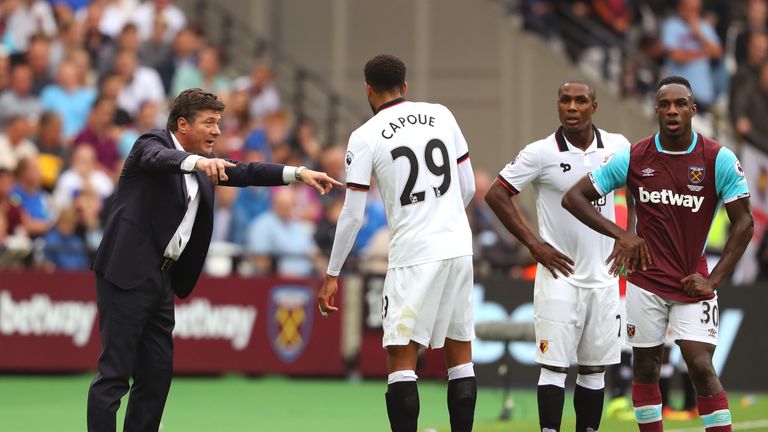 LONDON, ENGLAND - SEPTEMBER 10:  Walter Mazzarri, Manager of Watford gives Etienne Capoue of Watford intructions during the Premier League match between We