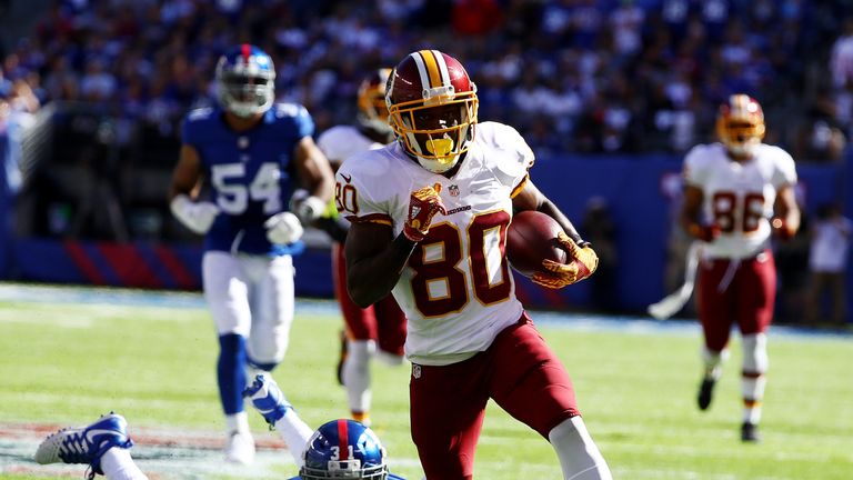EAST RUTHERFORD, NJ - SEPTEMBER 25:  Jamison Crowder #80 of the Washington Redskins scores a touchdown after  Trevin Wade #31 of the New York Giants misses