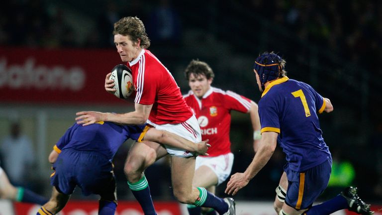 Will Greenwood of the Lions is tackled by Otago's Nick Evans 