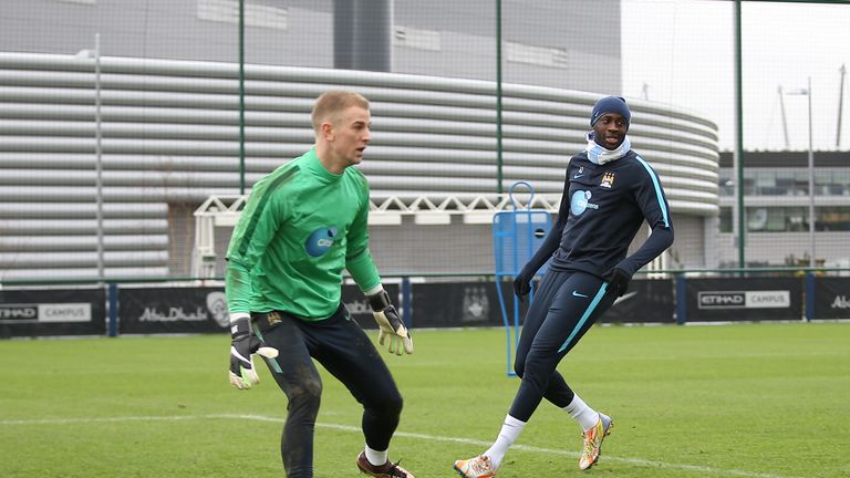 Manchester City goalkeeper Joe Hart and Manchester City's Yaya Toure during a training session. 