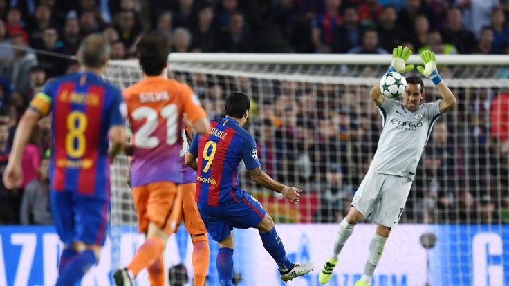 Claudio Bravo of Manchester City handles the shot from Luis Suarez of Barcelona outside of his area 