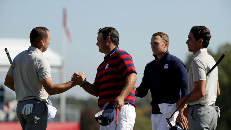 CHASKA, MN - OCTOBER 01: Sergio Garcia and Rafa Cabrera Bello of Europe shake hands with Patrick Reed and Jordan Spieth of the United States at the end of 
