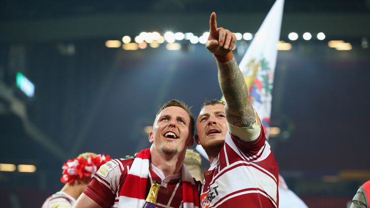 MANCHESTER, ENGLAND - OCTOBER 08:  Dan Sarginson and Josh Charnley of Wigan Warriors celebrate victory in the First Utility Super League Final between Warr