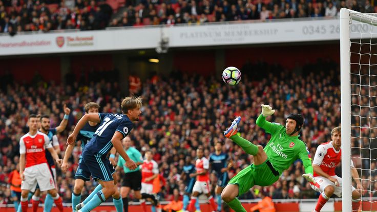 LONDON, ENGLAND - OCTOBER 22:  Petr Cech of Arsenal (R) saves Gaston Ramirez of Middlesbrough (L) header  during the Premier League match between Arsenal a