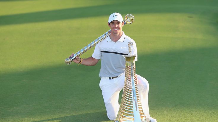 Rory McIlroy with the Race To Dubai and DP World Tour Championship trophies