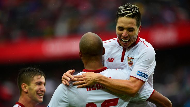 Sevilla midfielder Steven N'Zonzi (back) celebrates a goal with Samir Nasri 