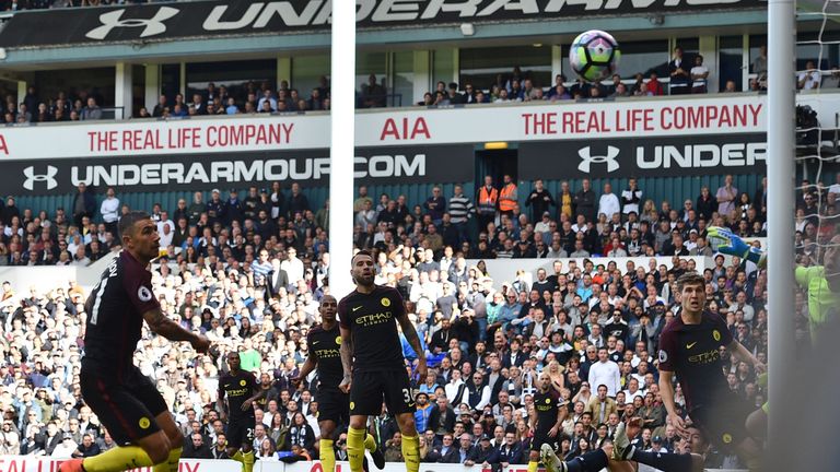 Manchester City's Serbian defender Aleksandar Kolarov (L) watches his attempted clearance bounce into the net for an own goal during the English Premier Le