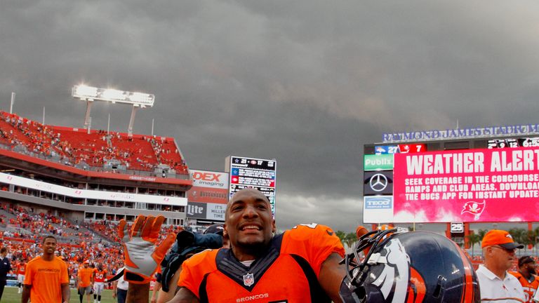 TAMPA, FL - OCTOBER 2: Aqib Talib #21 of the Denver Broncos plays to the fans as he and players from both teams leave the field because of bad weather duri