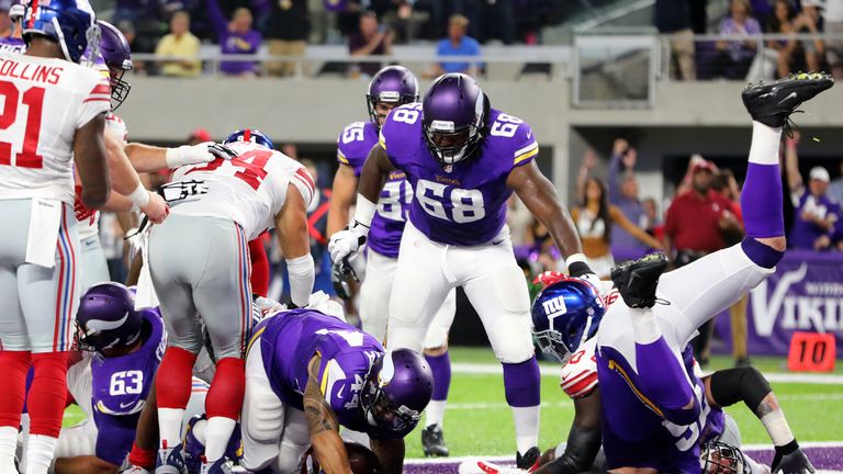 MINNEAPOLIS, MN - OCTOBER 3: Matt Asiata #44 of the Minnesota Vikings rushes for a touchdown in the first quarter of the game against the New York Giants o