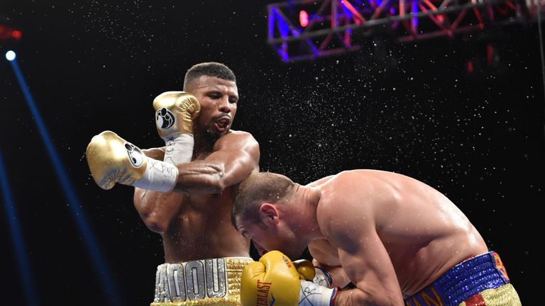 Jack Badou of Sweden (L) swings at Lucian Bute of Canada during their WBC Super Middleweight Championship boxing match in Washington, DC, May 1, 2016. The 