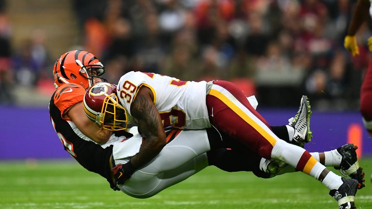 LONDON, ENGLAND - OCTOBER 30:  Tyler Eifert #85 of the Cincinnati Bengals is tackled by Keith Marshall #39 of the Washington Redskins during the NFL Intern