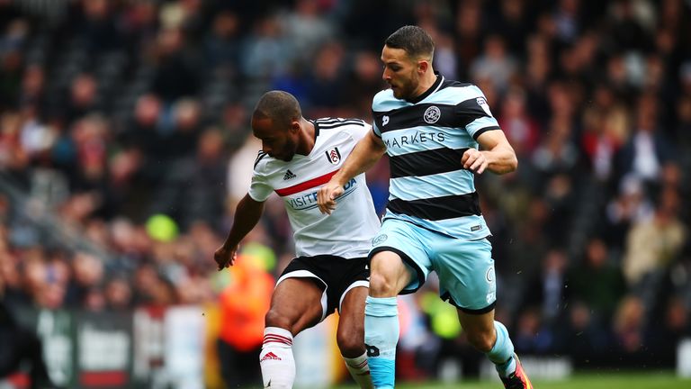 Conor Washington of QPR tackles with Denis Odoi of Fulham 