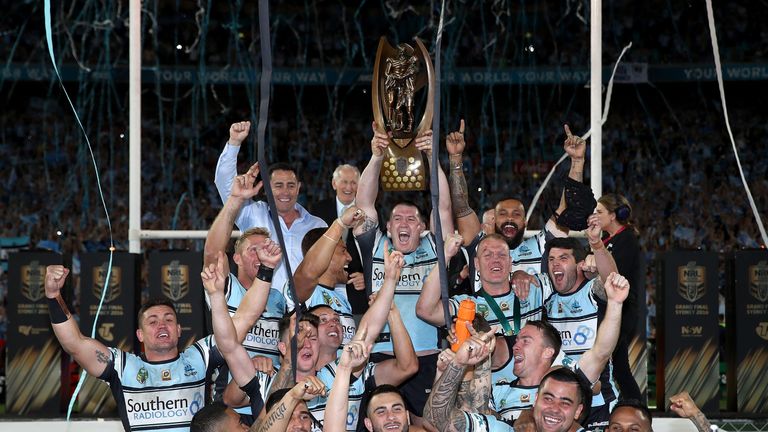 The Sharks celebrate with the Premiership Trophy after winning the 2016 NRL Grand Final