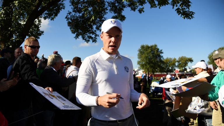 CHASKA, MN - SEPTEMBER 29: Danny Willett of Europe signs autographs for fans during practice prior to the 2016 Ryder Cup at Hazeltine National Golf Club on