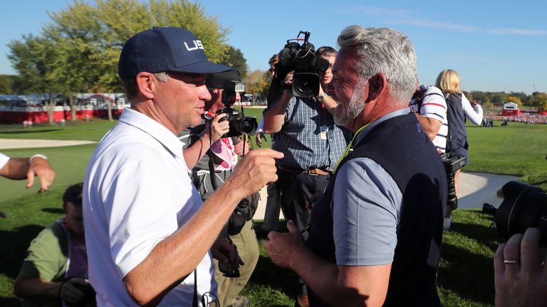 Love is congratulated by European skipper Darren Clarke