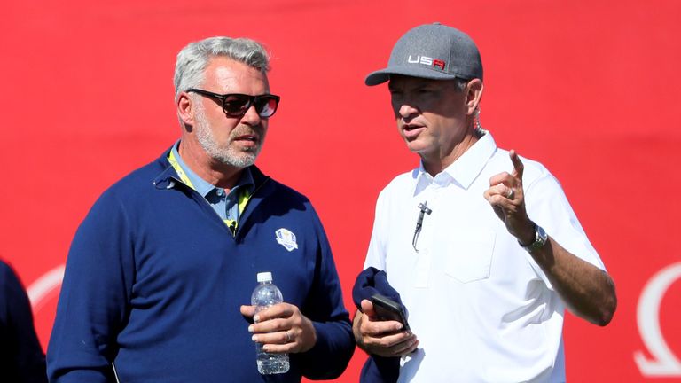 Darren Clarke and Davis Love III compare notes during the afternoon fourballs