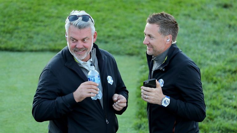 CHASKA, MN - OCTOBER 01: Captain Darren Clarke of Europe speaks to vice-captain Ian Poulter during morning foursome matches of the 2016 Ryder Cup at Hazelt