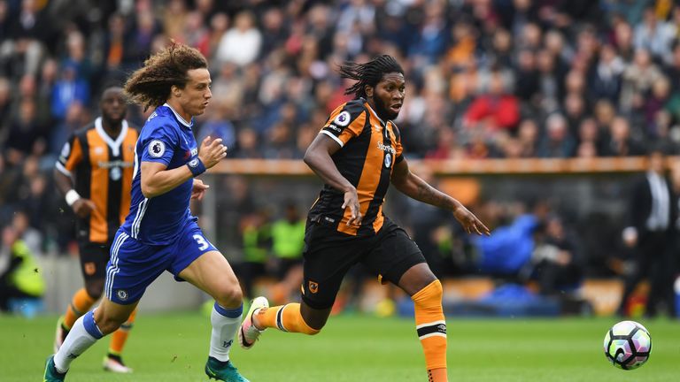 Dieumerci Mbokani of Hull City and David Luiz of Chelsea battle for possession  during the Premier League match between Hull Ci
