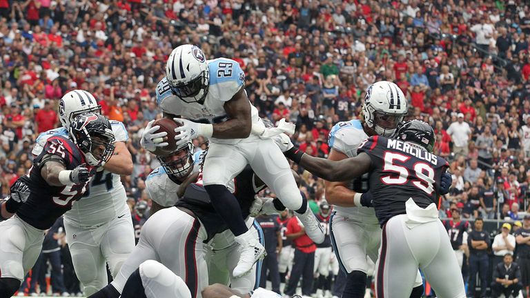 HOUSTON, TX - OCTOBER 2: DeMarco Murray #29 of the Tennessee Titans leaps over the Houston Texans defensive line for a touchdown in the second quarter duri