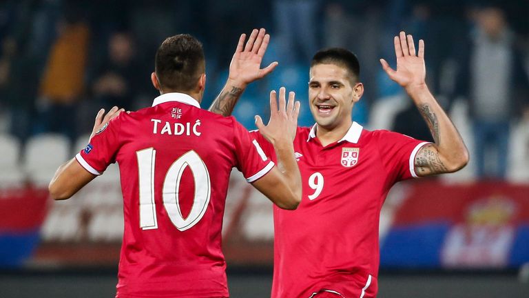 Serbia duo Dusan Tadic and Aleksandar Mitrovic celebrate