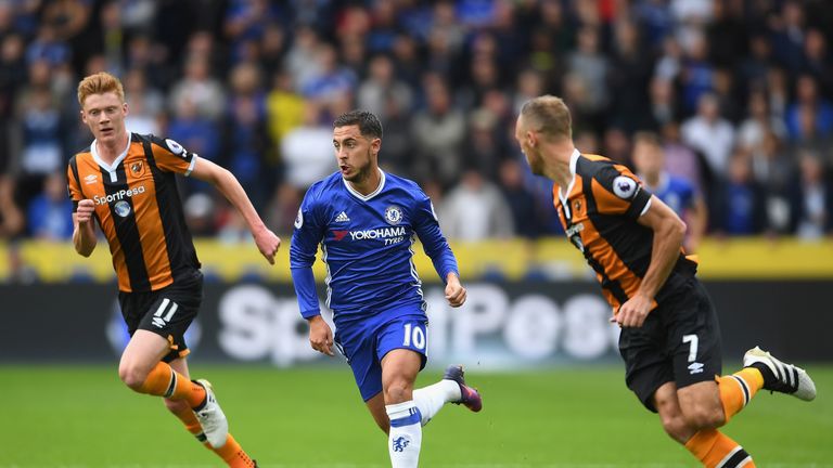 Chelsea's Eden Hazard takes the ball past David Meyler (R) and Sam Clucas of Hull City 