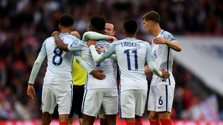 Daniel Sturridge celebrates with team mates after scoring the opening goal of the game 