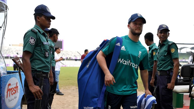 DHAKA, BANGLADESH - OCTOBER 02:  Ben Duckett of England walks past armed guards as they arrive for a nets session at Sher-e-Bangla National Cricket Stadium