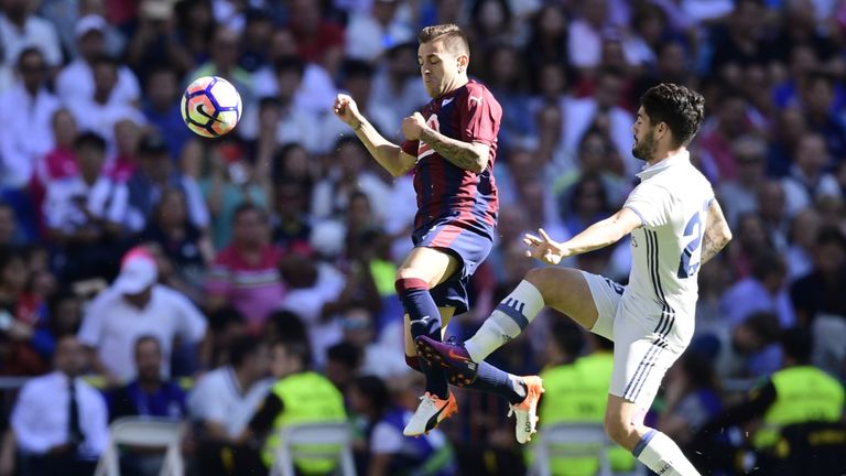 Eibar's midfielder Eibar's midfielder Fran Rico (L) vies with Real Madrid's midfielder Isco during the Spanish league football match Real Madrid CF vs SD E