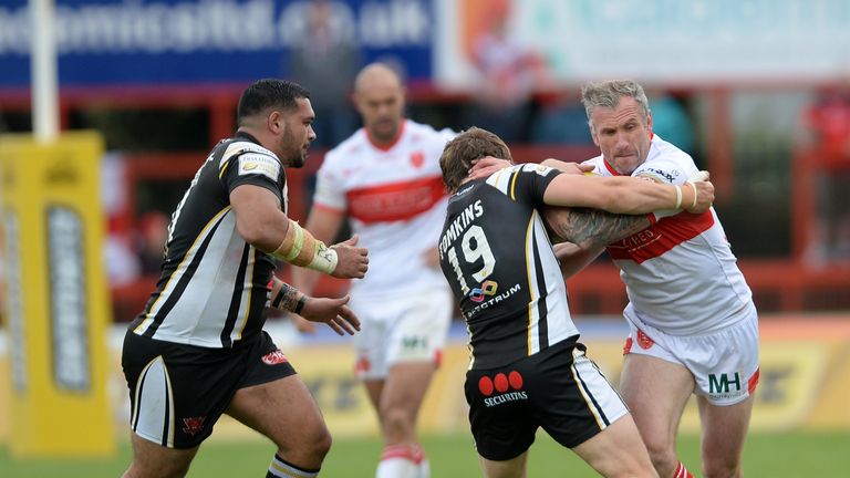 Hull Kingston Rovers' Jamie Peacock is tackled by Salford Red Devils' Logan Tomkins during of the First Utility Super League, Million Pound Game at Craven 