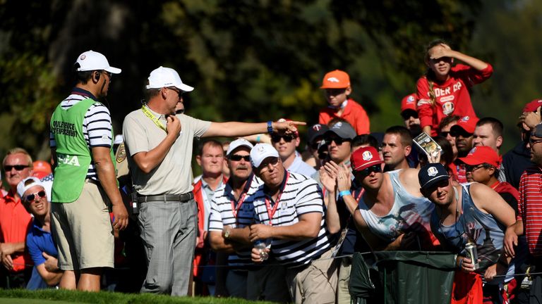 Ian Poulter points out a troublemaker on the second day