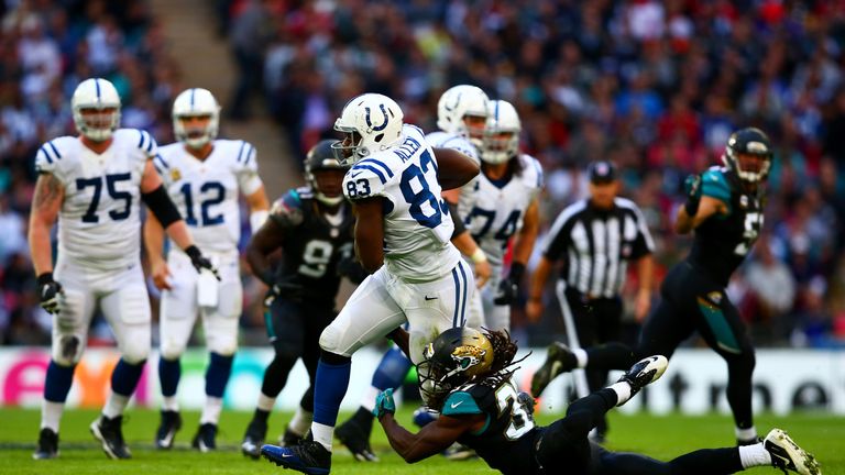 LONDON, ENGLAND - OCTOBER 02:  Dwayne Allen #83 of the Indianapolis Colts is tackled by  Johnathan Cyprien #37 of the Jacksonville Jaguars during the NFL g