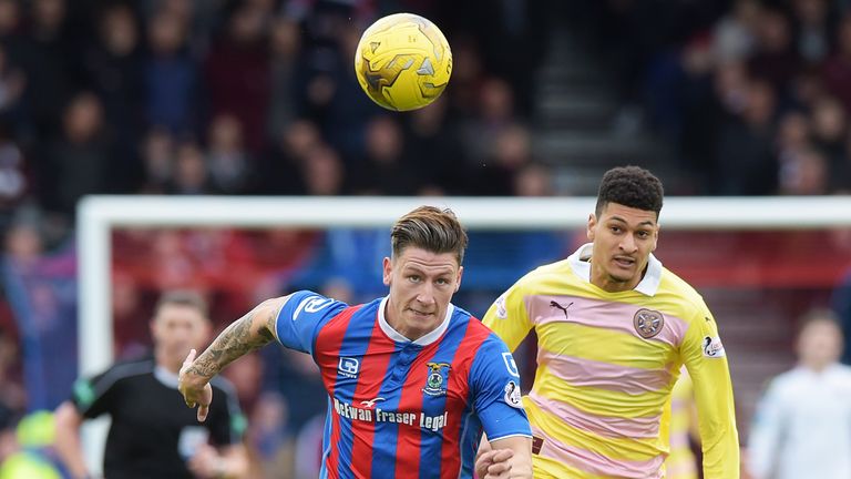 Josh Meekings and Bjorn Johnsen chase the ball down