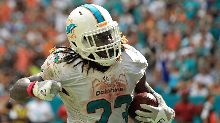 MIAMI GARDENS, FL - OCTOBER 16:  Jay Ajayi #23 of the Miami Dolphins celebrates a touchdown during a game against the Pittsburgh Steelers on October 16, 20