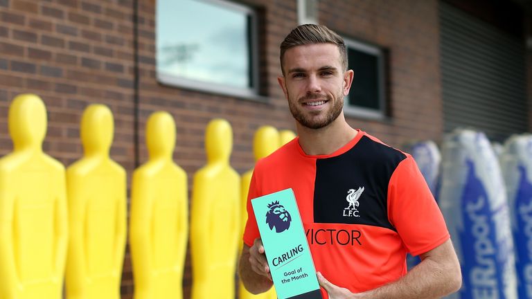 Liverpool's Jordan Henderson poses with the Premier League goal of the month trophy for September 2016 at Melwood Training Ground