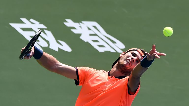Karen Khachanov of Russia serves against Viktor Troicki of Serbia during their singles semi-final match at Chengdu Open ATP tennis tournament in Chengdu, s