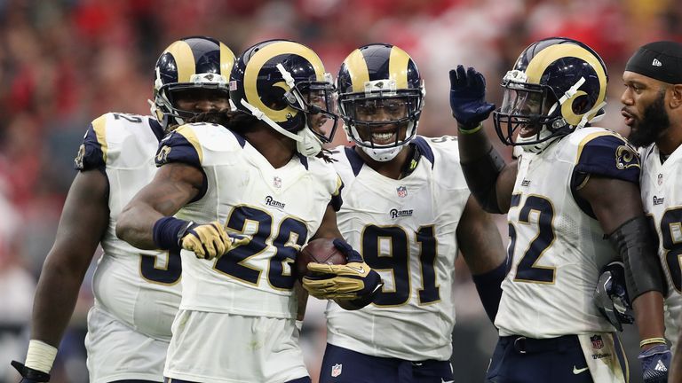 GLENDALE, AZ - OCTOBER 02:  Outside linebacker Mark Barron #26 of the Los Angeles Rams celebrates with  Dominique Easley #91 and Alec Ogletree #52 after an
