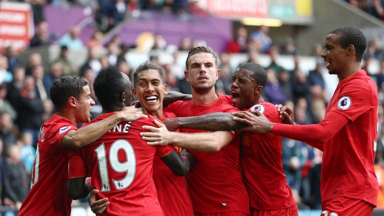 Liverpool's players celebrate Roberto Firmino's equaliser against Swansea