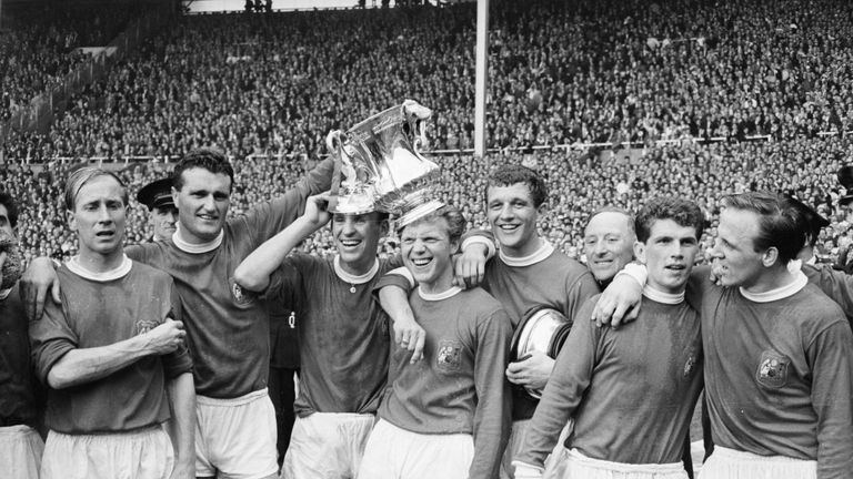 25th May 1963:  Members of the Manchester United football team celebrating after beating Leicester City in the FA Cup final, including (from left) Bobby Ch