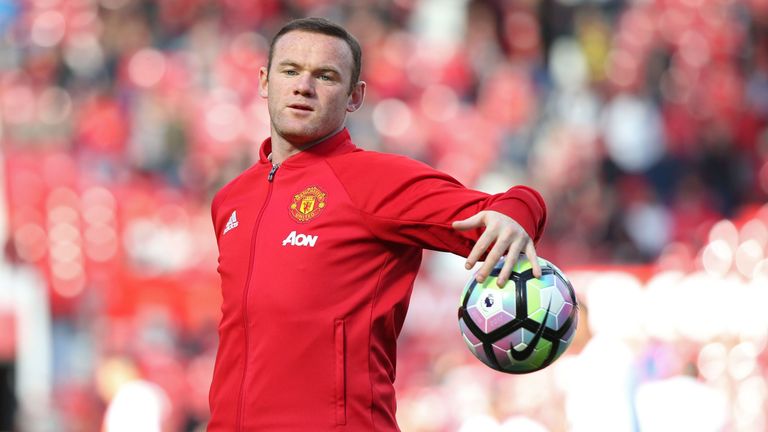 Wayne Rooney warms up ahead of the match between Manchester United and Stoke