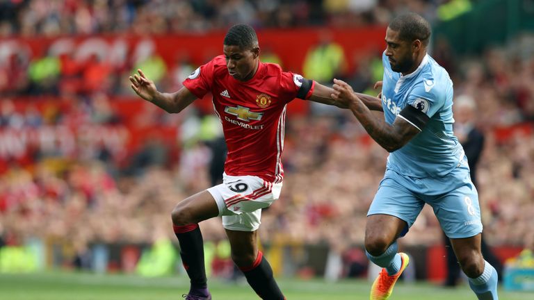 Manchester United's Marcus Rashford (left) and Stoke City's Glen Johnson battle for the ball before the Premier League match at Old Trafford, Manchester. P