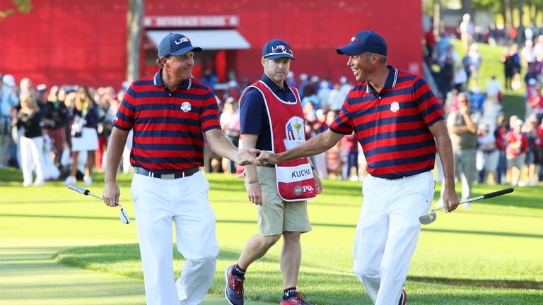 CHASKA, MN - OCTOBER 01:  Phil Mickelson and Matt Kuchar of the United States reacts after a putt by Kuchar on the 13th green during afternoon fourball mat