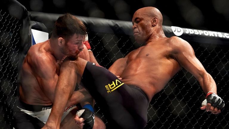 British fighter Michael Bisping (L) competes with Anderson Silva of Brazil (R) during their middleweight bout at the Ultimate Fighting Championship (UFC) F